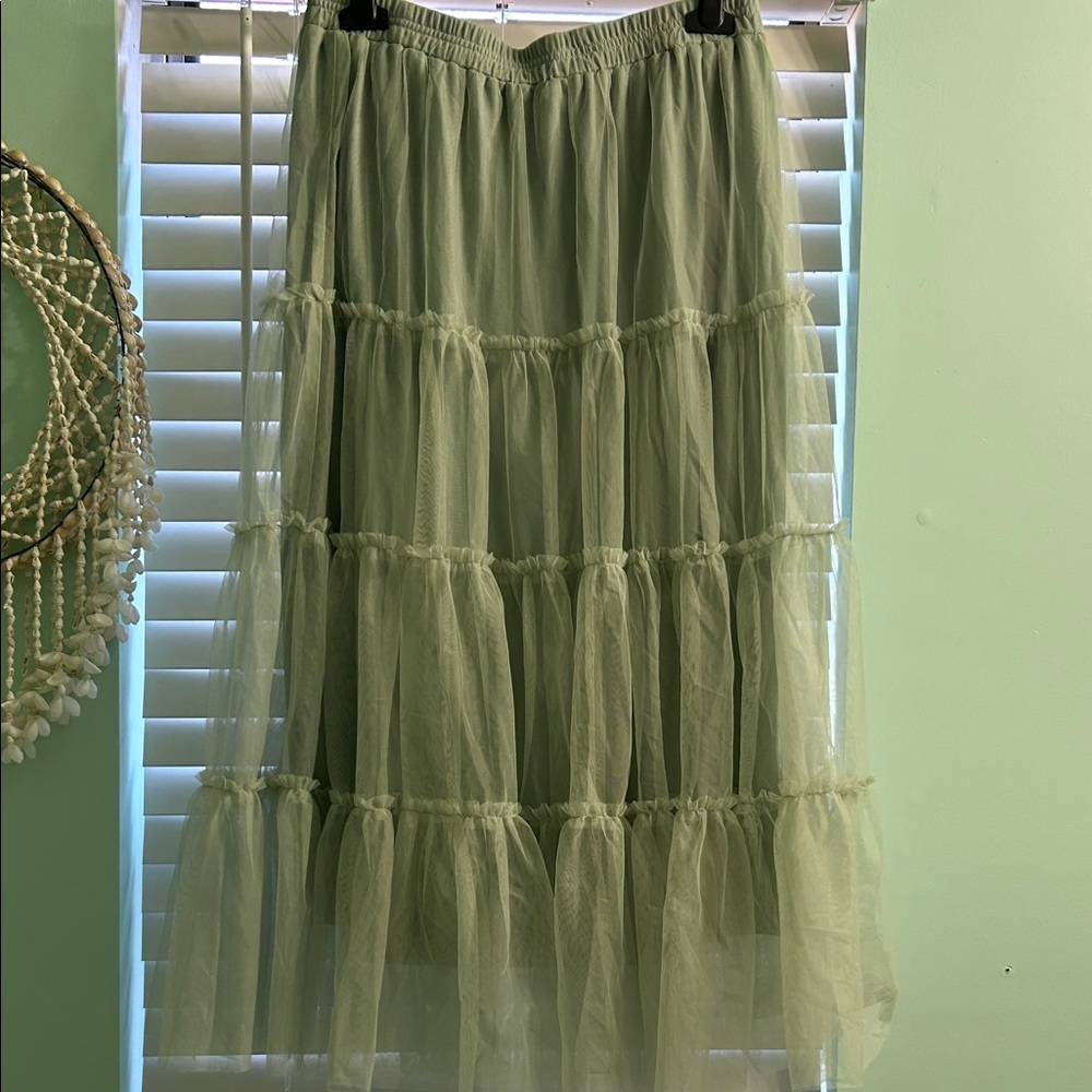 Design skirt mid length Forest green skirt. Size Large with stretch waist lined.